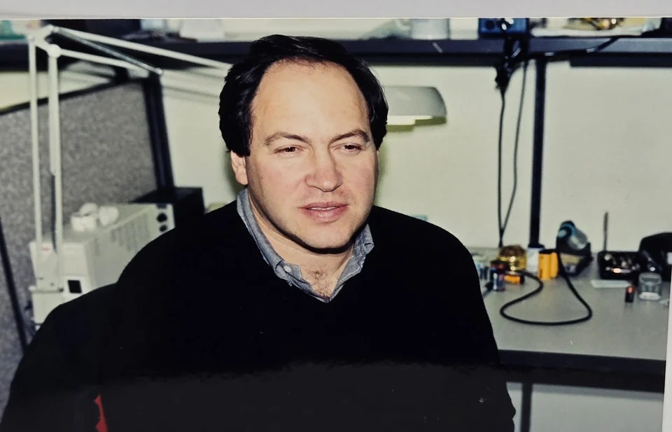 Leon Treskunov at a workbench with technical equipment during his Kyocera years, 2002
